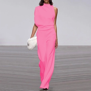 Detail of neon pink one-shoulder jumpsuit with draped neck and wide-leg trousers