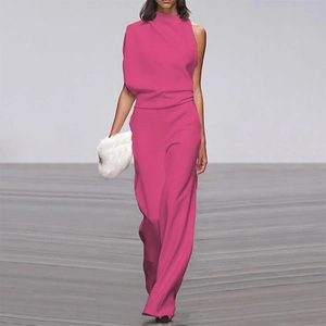 Detail of rose pink one-shoulder jumpsuit featuring draped neckline and wide leg cut