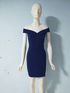 Detail of elegant navy off-shoulder dress featuring a V-neckline and slim fit cut