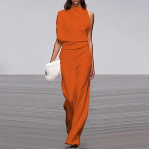 Detail of elegant bright orange asymmetric high-neck top and wide-leg trouser set