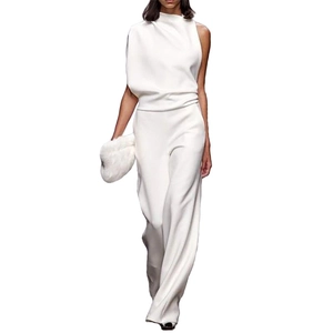 Detailed view of white one-shoulder jumpsuit with pleated neck and wide-leg trousers