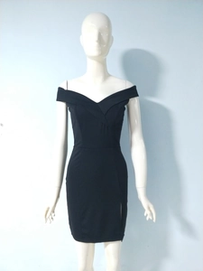 Detail of a black bodycon dress with off-shoulder design and side slit for a slim fit look