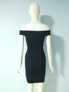 Detail view of the sleek back zipper closure on this black off-shoulder slim-fit dress
