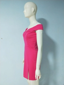 Detail of elegant off-shoulder magenta dress featuring a chic side slit and pleated V-neckline