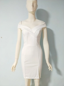 Detail of off-shoulder neckline and slim-fit waist on white split maxi dress