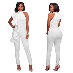 Detail of elegant white jumpsuit featuring large ruffles and a stylish high neck design