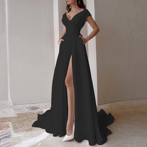 Detail of elegant black V-neck satin dress showing the thigh-high slit and side pockets