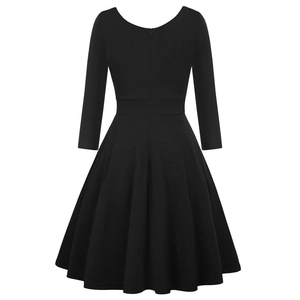 Detailed view of the elegant black A-line dress featuring a round neck and pleated skirt