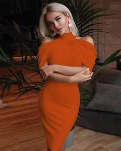 Detail of orange halter cold-shoulder bodycon dress showing the slim fit and fabric texture