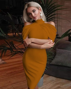 Close-up of mustard yellow halter neck bodycon dress showing its slim fit and midi length