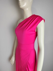 Detail of hot pink one-shoulder dress featuring elegant shoulder pleats and waist tailoring
