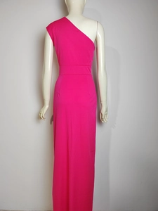 Detail view of the back of a rose pink one-shoulder maxi dress with a fitted waistline