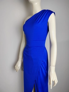 Detail of royal blue one-shoulder dress showing waist pleats and front wrap slit