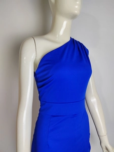 Detail of royal blue one-shoulder dress with elegant pleated neckline and slim waist cut