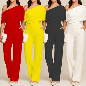 Detail view of one-shoulder jumpsuits in red, yellow, black and white color options
