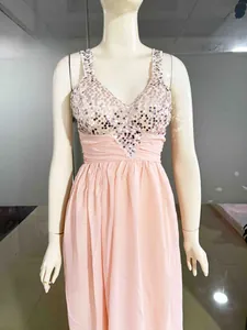Detail of sequined V-neck bodice and pleated waist on a pink chiffon evening dress