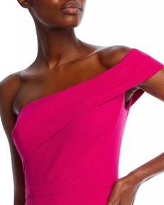 Detail of elegant one-shoulder dress with draped pleats and vibrant magenta fabric