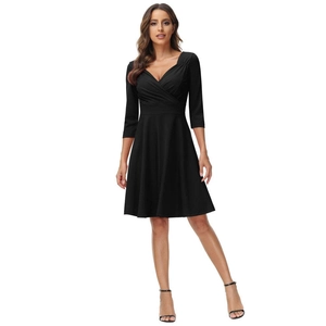 Detail of elegant black V-neck cocktail dress with waist-cinching and A-line silhouette