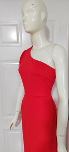 Detail view of red one-shoulder evening dress with elegant ruched shoulder and slim fit cut