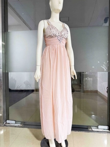 Detail of pink chiffon evening dress featuring a sequined V-neck bodice and pleated waist