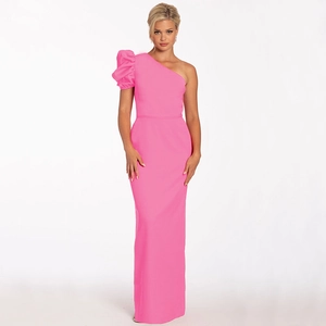 Detail of elegant pink one-shoulder evening gown with dramatic puff sleeve design