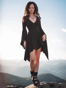 Detail of elegant black deep V-neck dress with ruffle sleeves and irregular hemline