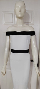 Detail of contrast color off-shoulder neckline and slim fit design on white bodycon dress