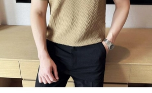 Close-up of khaki knit polo shirt featuring a detailed herringbone textured pattern