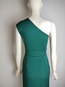 Rear view of elegant one-shoulder high waist emerald green dress with back slit detail