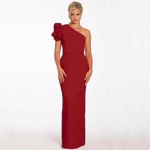 Detail of red one-shoulder evening gown featuring a satin lantern sleeve and slim fit