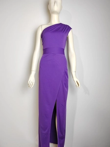 Detail of elegant one-shoulder purple evening gown featuring waist belt and high side slit