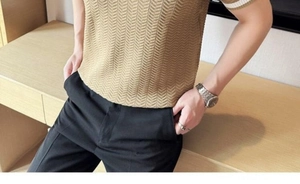 Detailed close-up of khaki chevron knit polo shirt with white striped ribbed collar and cuffs