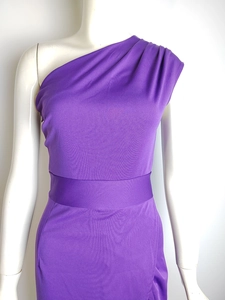 Detail view of the elegant one-shoulder pleated bodice on this purple evening gown