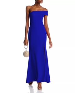 Detail of royal blue one-shoulder slim fit gown with high slit and pearl ball bag