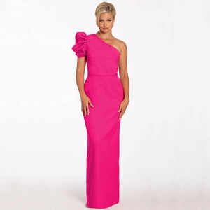 Close-up of bright pink one-shoulder gown featuring an elegant puffed lantern sleeve detail