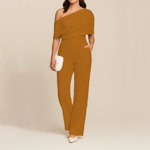 Detail of elegant one-shoulder mustard yellow wide-leg jumpsuit with waist cinching