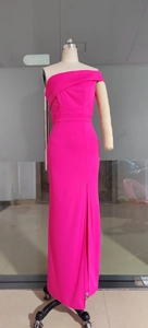 Detail of the high-slit design and elegant fabric texture on a fuchsia evening gown