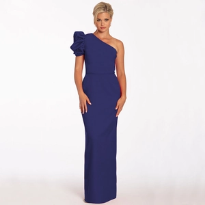 Detailed view of dark blue one-shoulder evening gown with ruffled lantern sleeve and slim fit