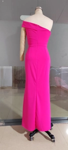 Detail view of rose red one-shoulder evening gown with back zipper and slim fit cut