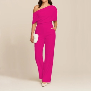 Detail view of fuchsia one-shoulder jumpsuit with pleated bodice and wide-leg trousers