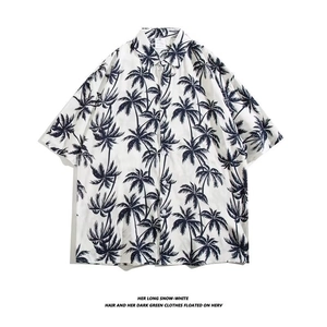 Detail of tropical black coconut tree print on white short sleeve Hawaiian shirt