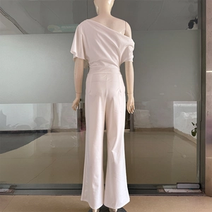 Back view of elegant off-shoulder wide-leg jumpsuit in ivory white fabric