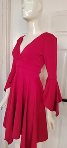 Detail of deep V-neckline and tiered ruffle sleeves on this red fitted dress