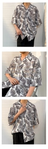 Detail view of the summer oversized Hawaiian leaf print shirt showing drape and fit