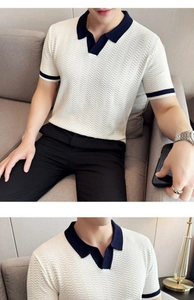 Detail of slim fit knit polo shirt with contrast collar and V-shaped ribbed texture