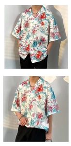 Close-up of tropical floral print and Cuban collar detail on vintage short sleeve shirt