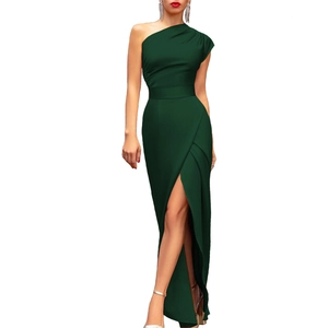 Detail of the high-waist front slit and draped pleats on this dark green one-shoulder dress