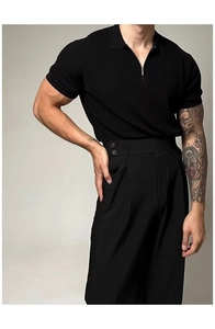 Detail of men's slim fit knit polo shirt with silver zipper collar and black fabric texture