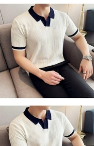 Detail view of knitted Polo shirt featuring textured wave pattern and navy contrast collar