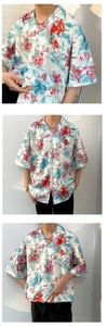 Detail of Hawaiian floral print short sleeve shirt with chest pocket and lapel collar